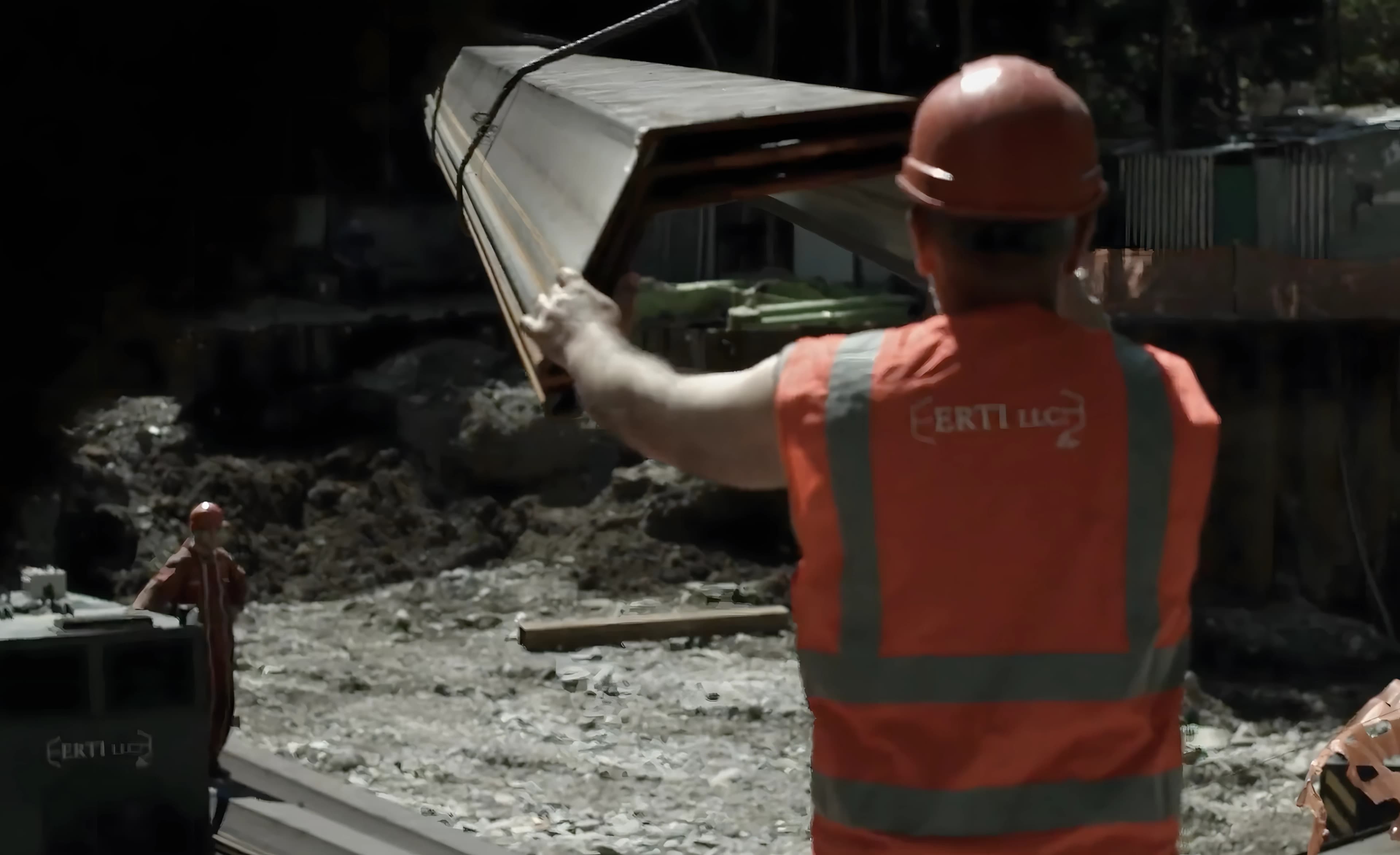 ERTI worker guiding sheet pile on site
